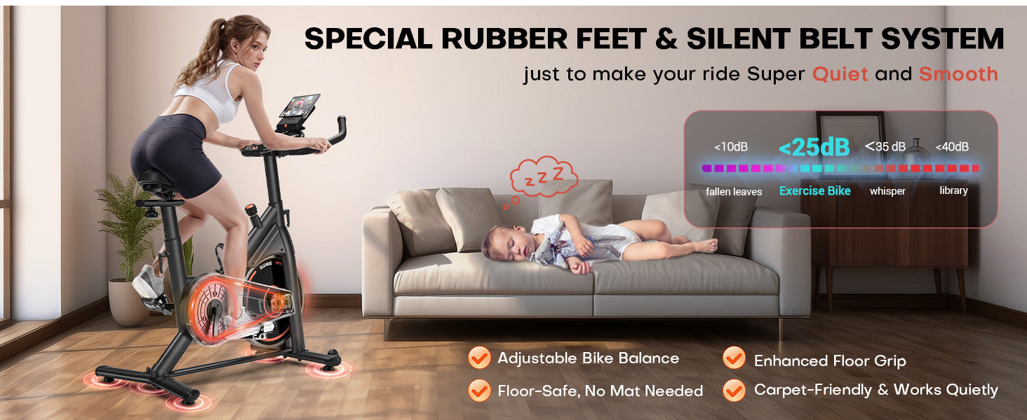 Kvinna tränar på en motionscykel med en bebis som sover på en soffa, med betoning på tystnad och komfort.